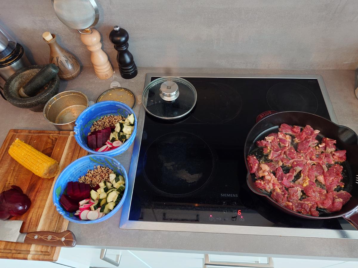 Prepped veg next to the first beef going into the pan