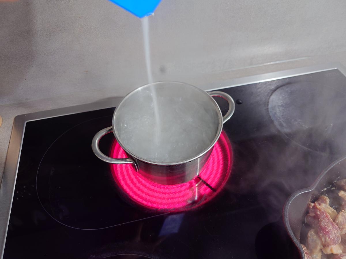 Salt poured into the boiling water