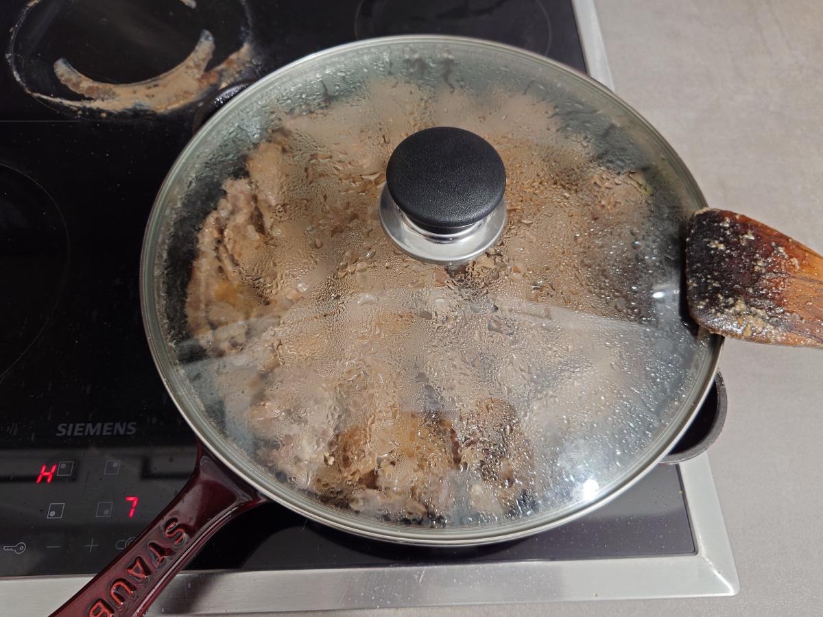 Lid on, the glass fogged with steam