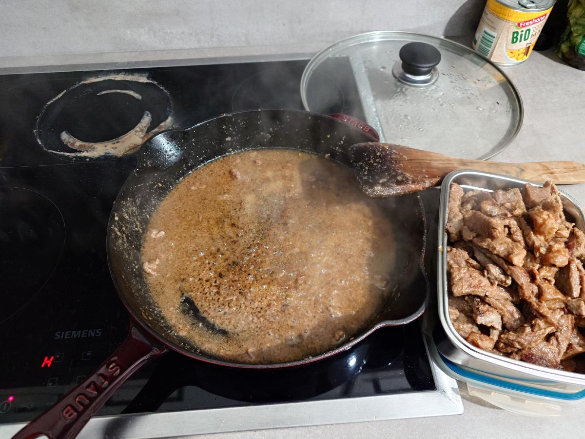 Beef lifted out, the pan left full of liquid