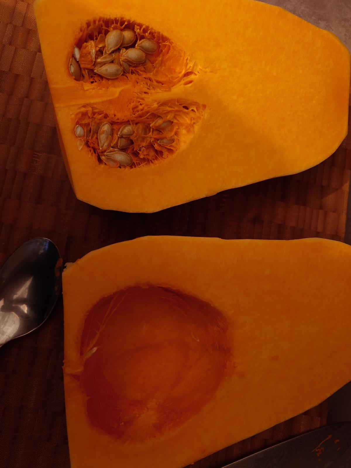 The bulb halved, seeds in one half, the other already scooped