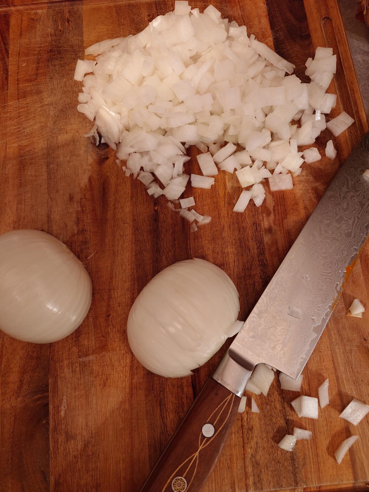 Onion diced on the board, two halves still to go