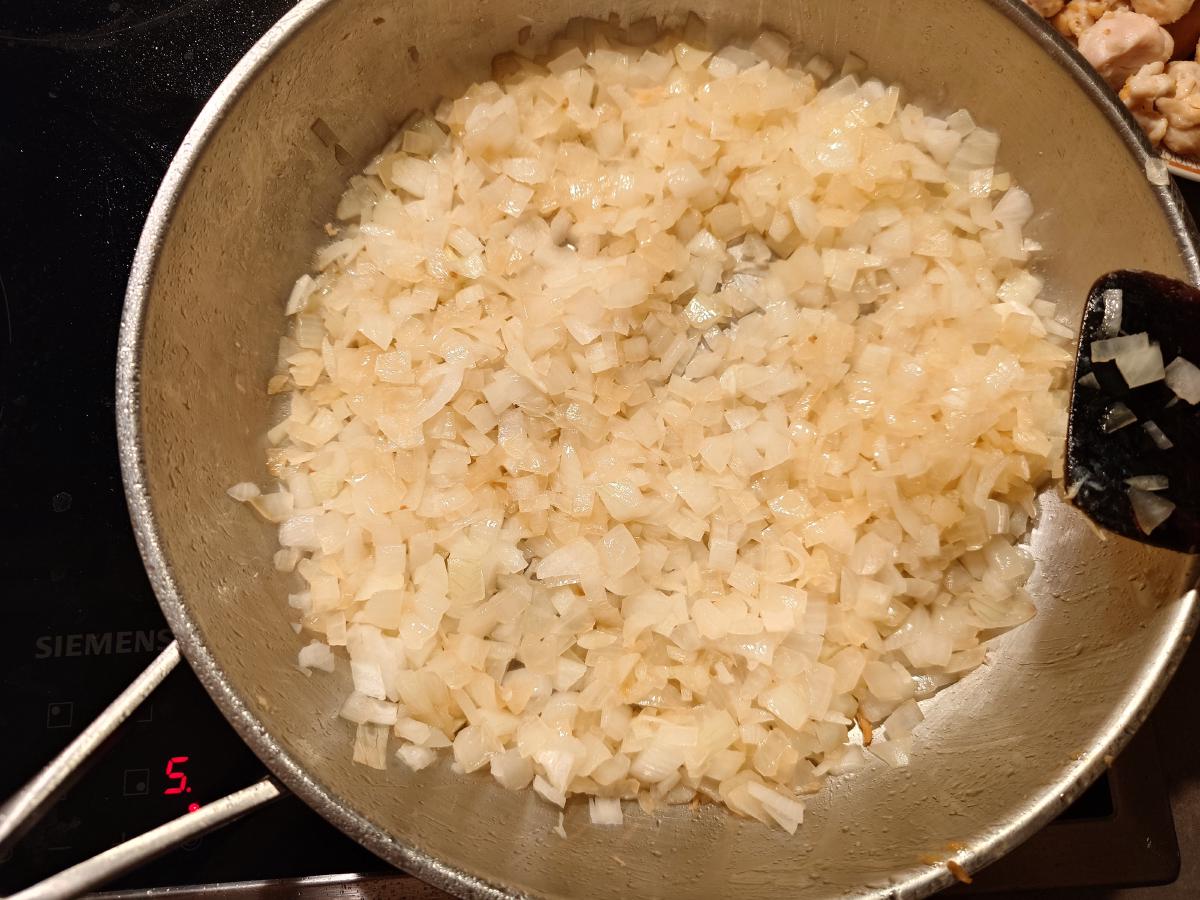 The onion softened and glassy, dial reading 5