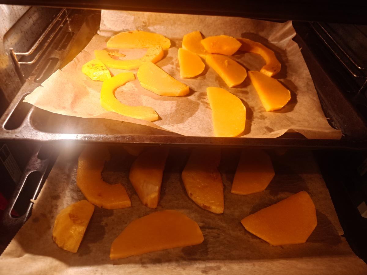 Both trays in the oven, the slices starting to take colour
