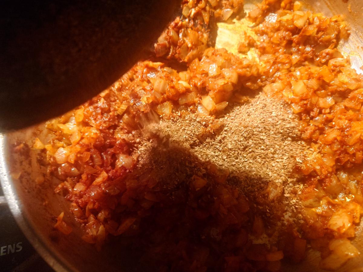 The ground spice added to the reddened onion