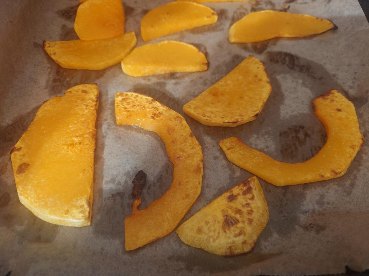 The finished tray, brown patches across the slices