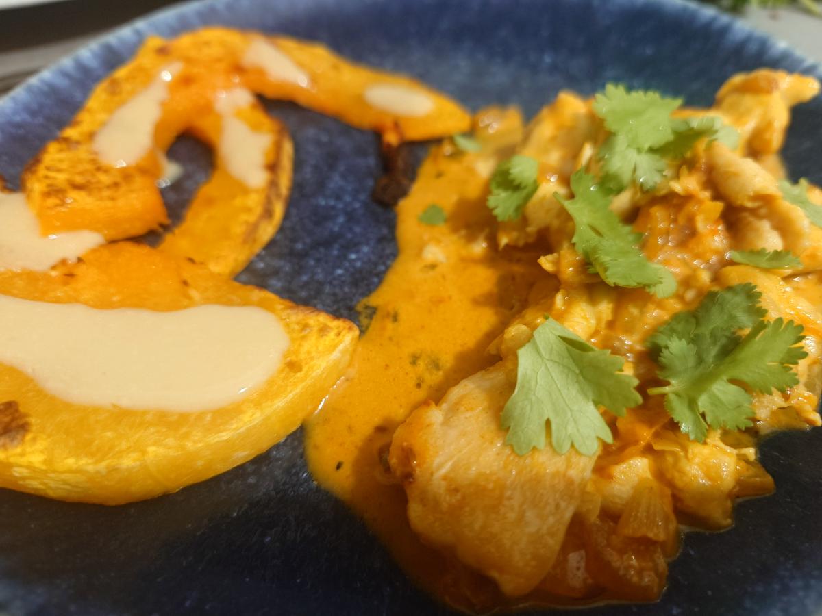 Roasted squash under miso beside the chicken in its coconut sauce, cilantro on top