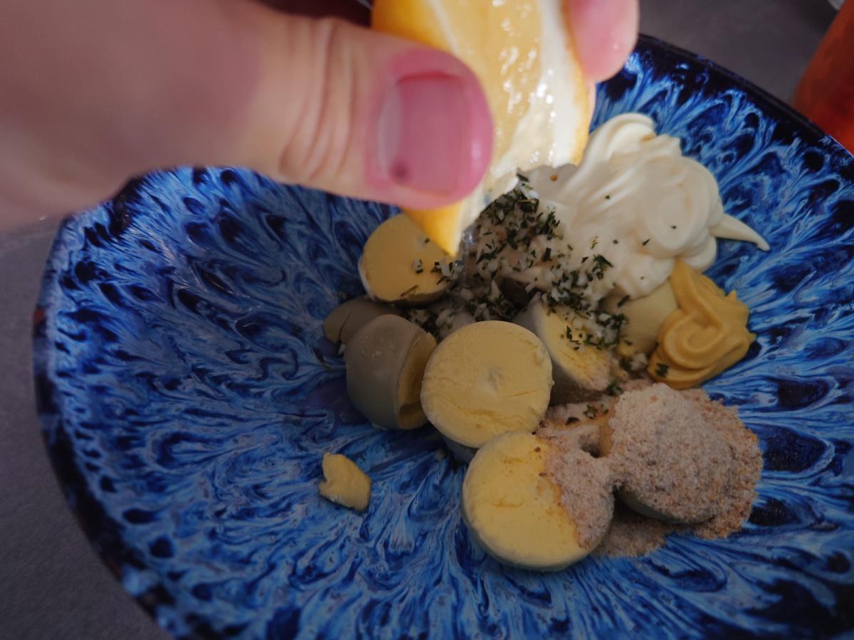 Lemon squeezed over the bowl