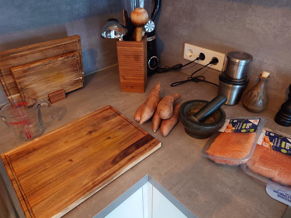 Sweet potatoes, salmon and the mortar out on the counter