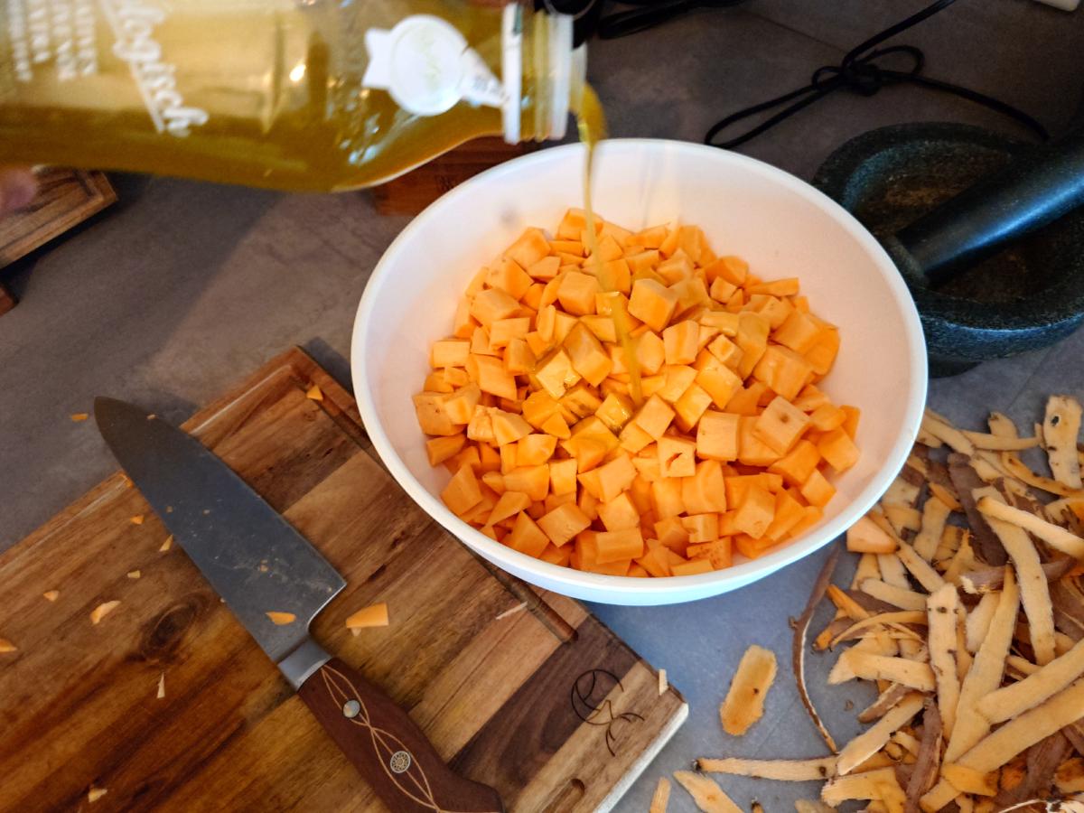 Olive oil poured over the diced potato