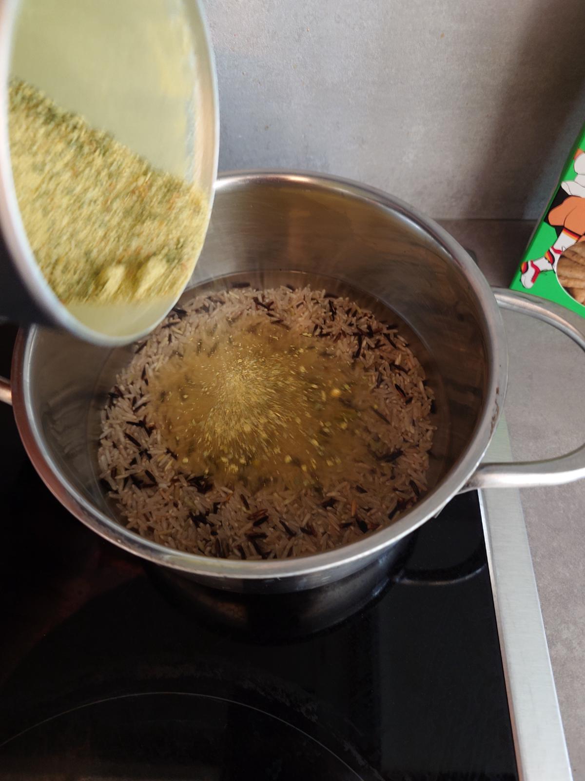 Stock poured over the rice