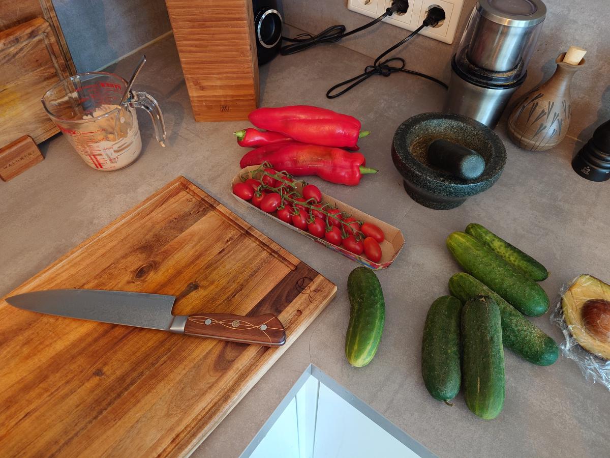Peppers, tomatoes and cucumbers on the counter