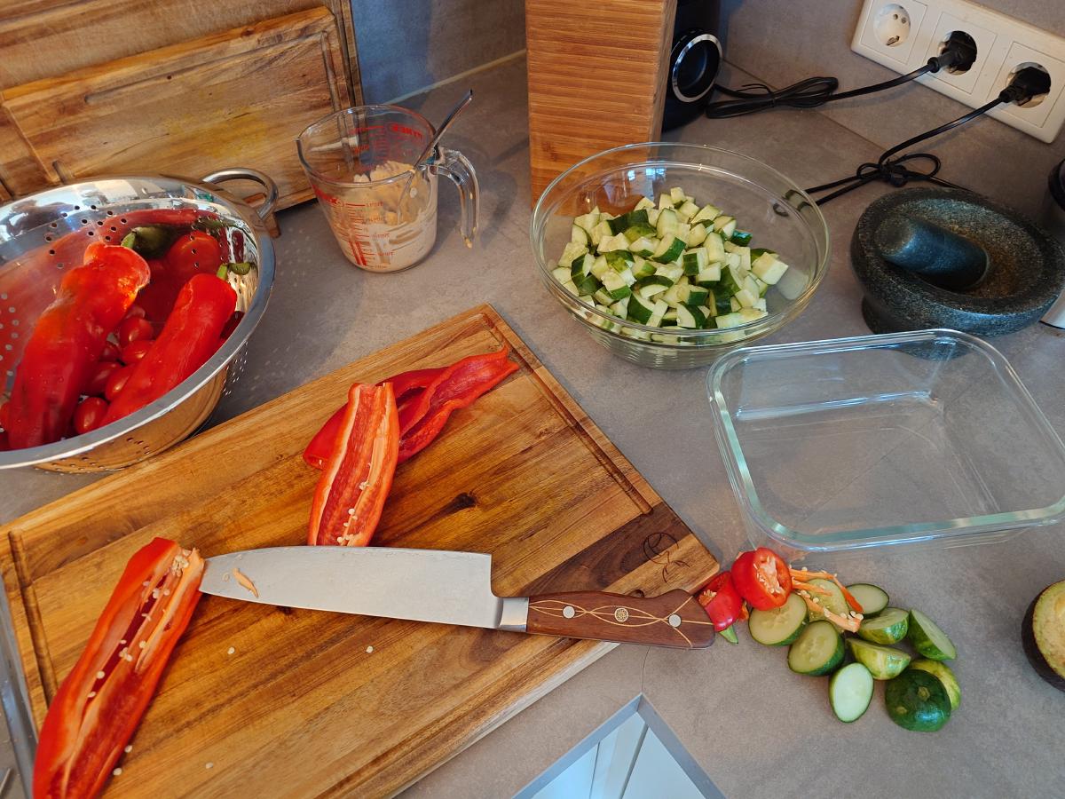 Cucumber diced, peppers being sliced