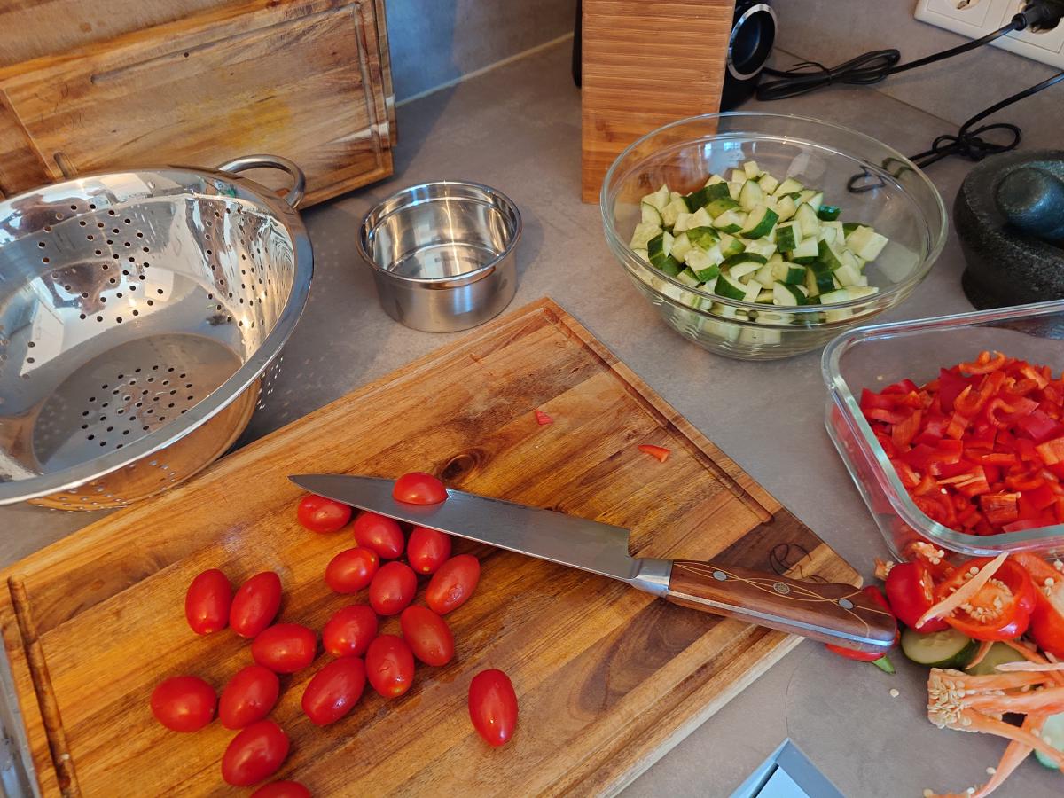 Cherry tomatoes halved on the board