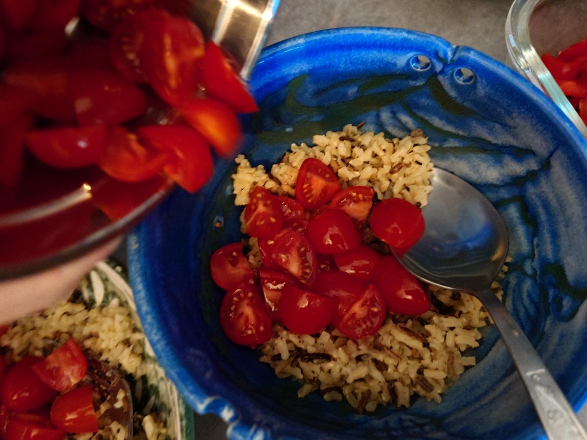 Tomatoes spooned over the rice