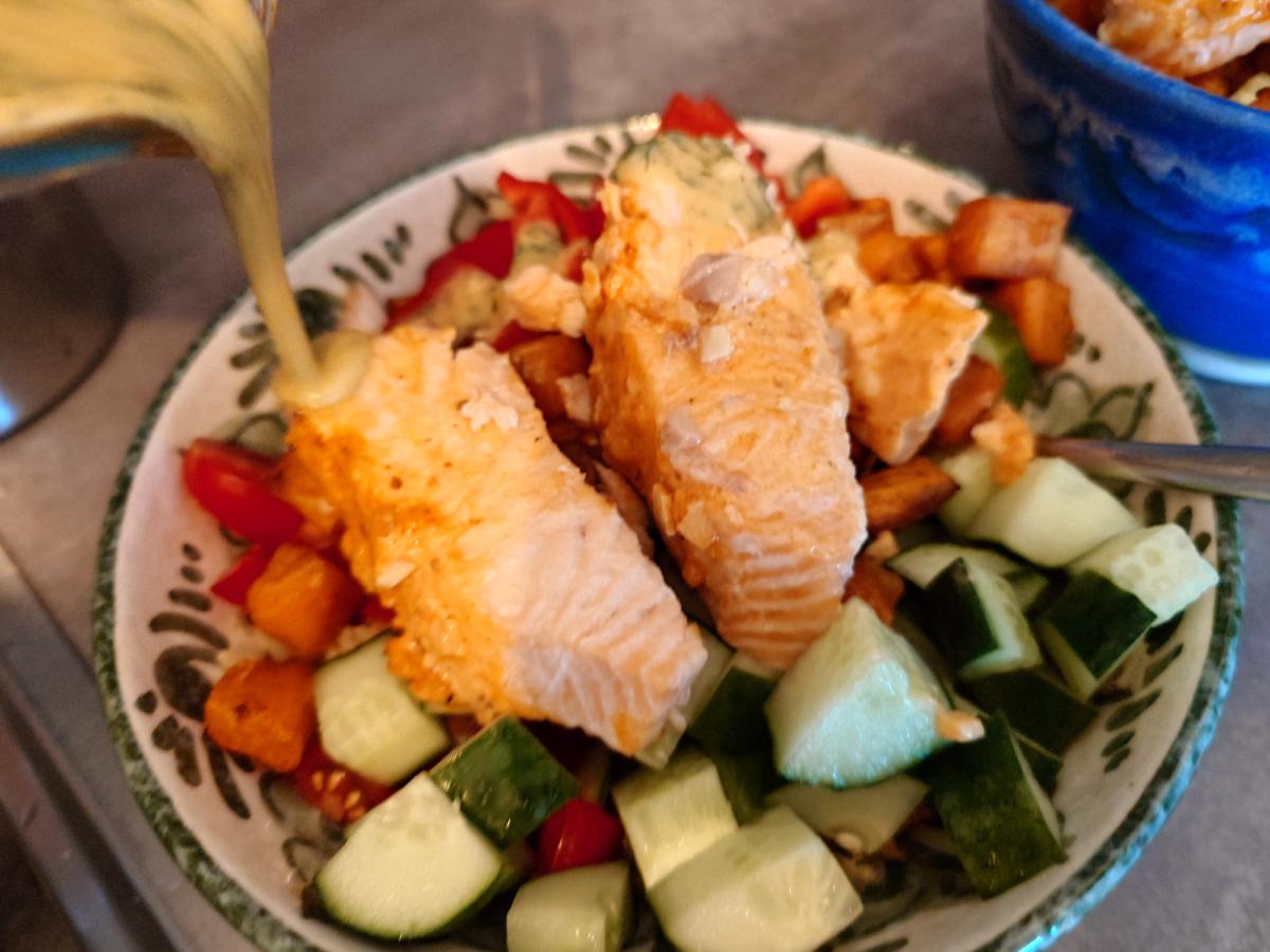 Salmon on top and the dressing poured over