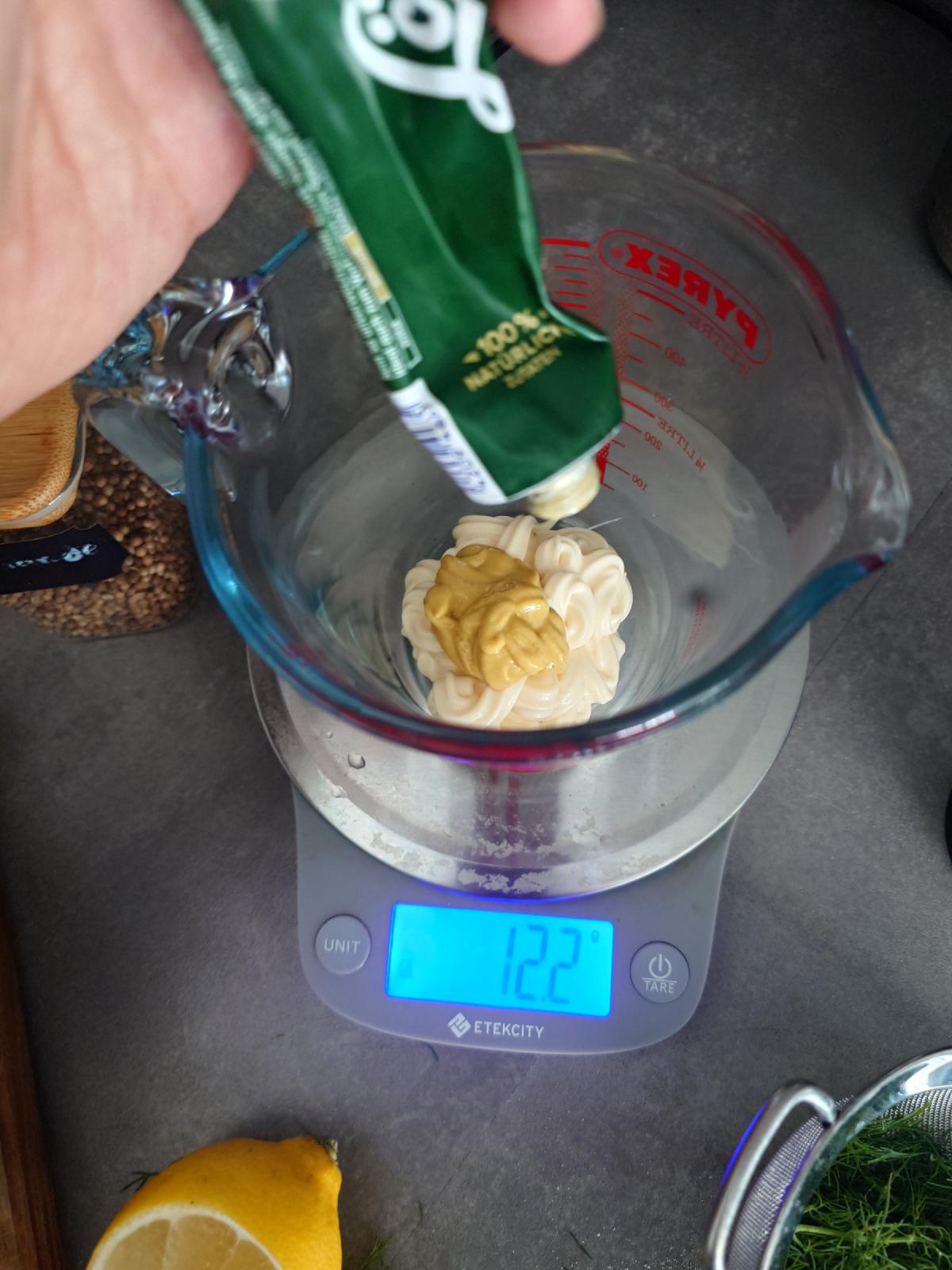 Mustard added on top of the mayonnaise