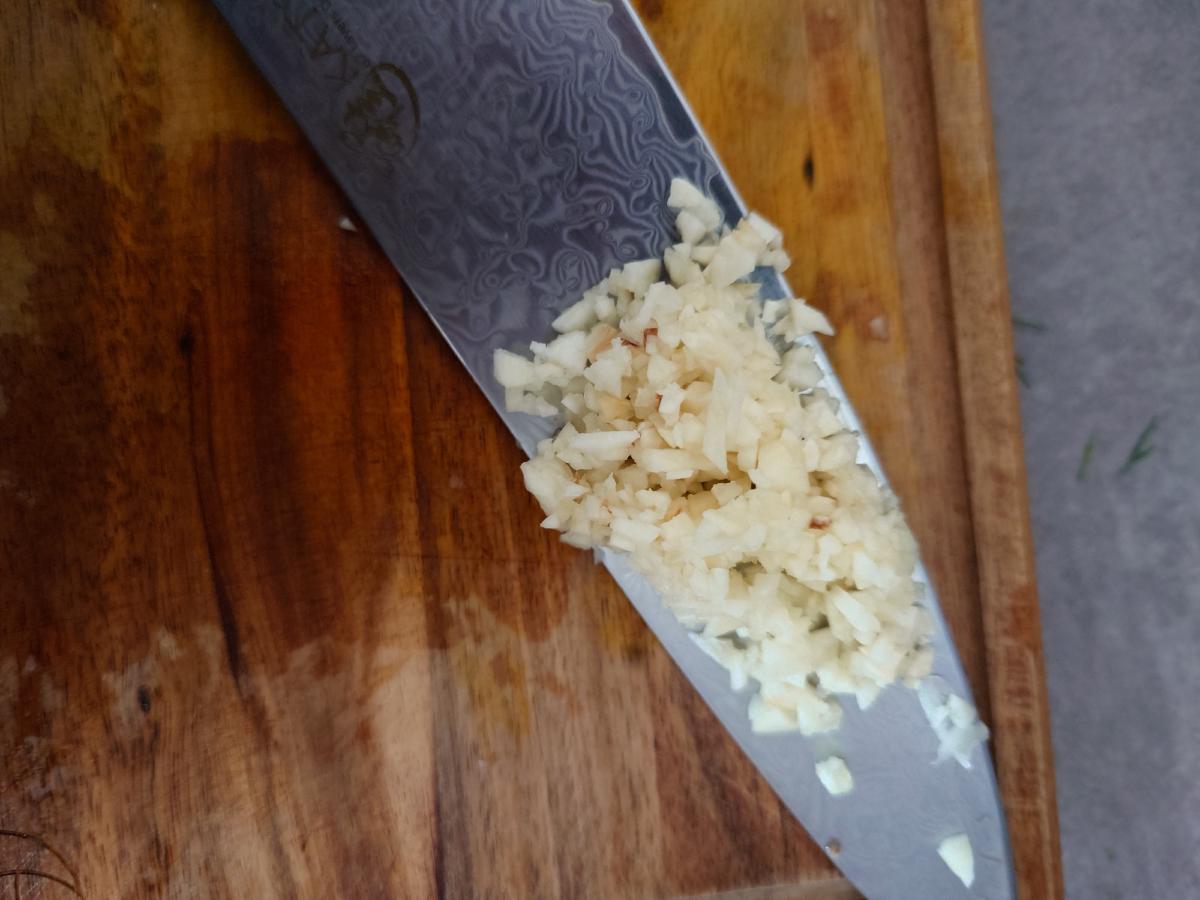 Garlic minced fine on the knife