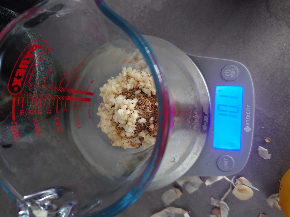Garlic and the cracked spice weighed into the jug