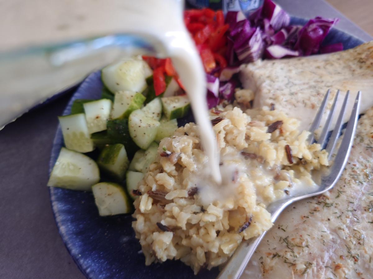 The pan juices poured over the rice, with the fish and raw veg alongside