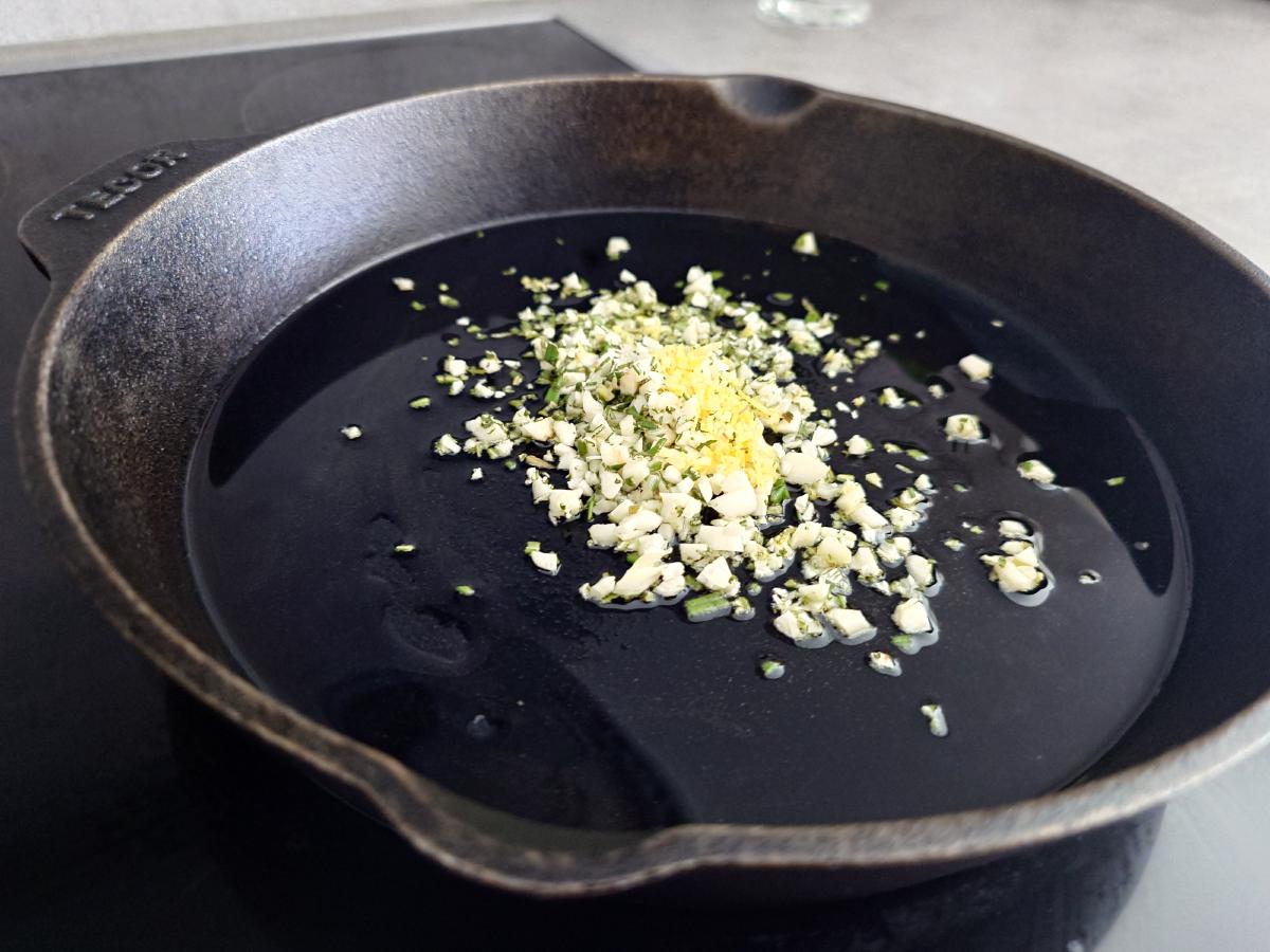 Garlic, rosemary and lemon zest in warm oil