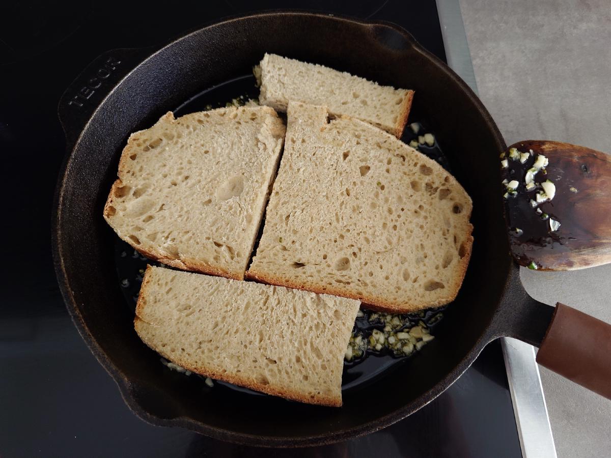 Bread laid into the garlicky oil