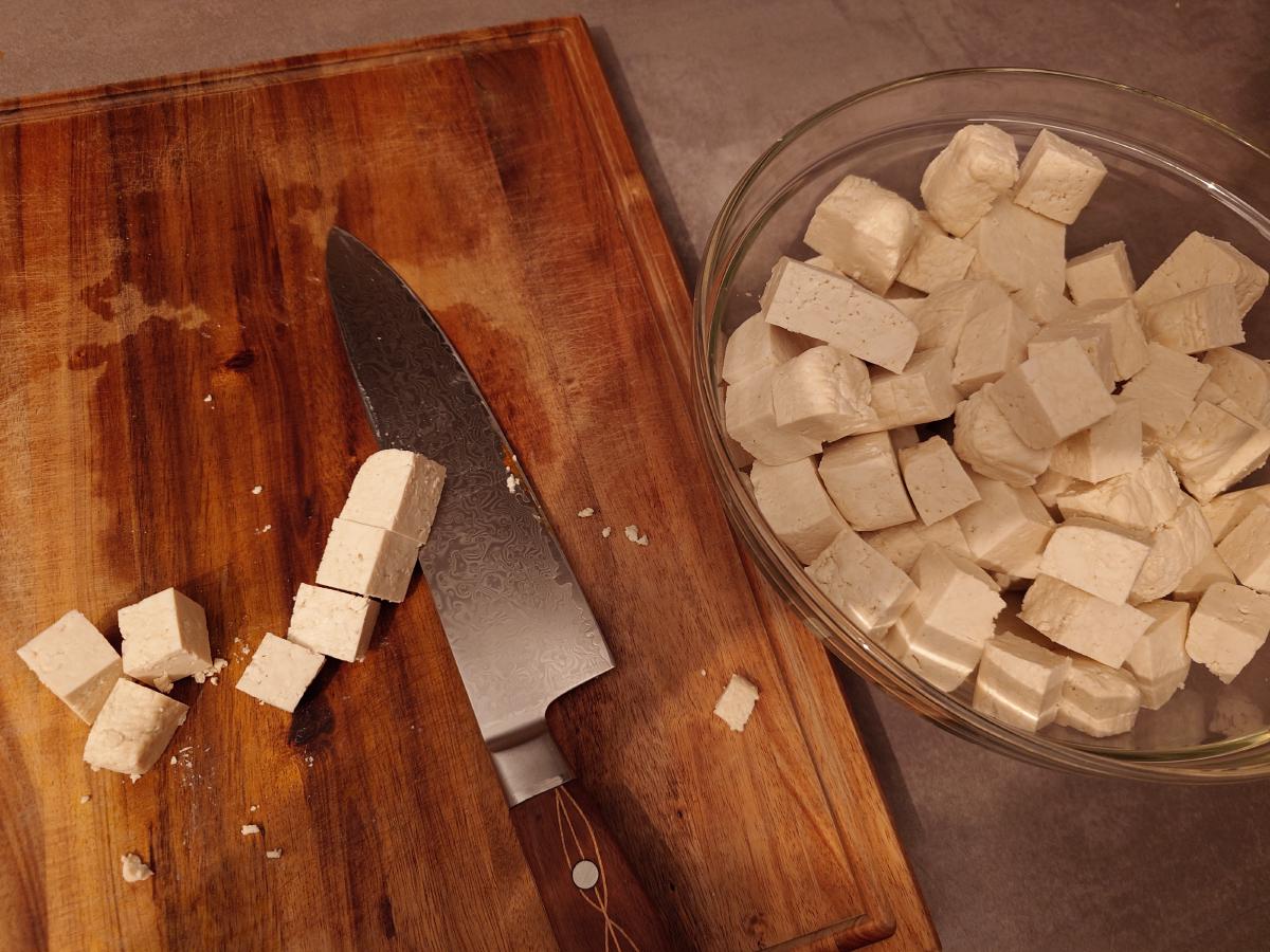The slabs cut down into cubes and tipped into a white bowl