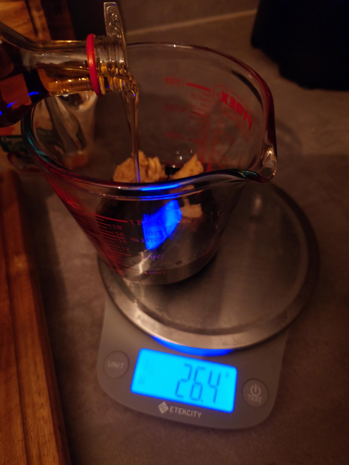 Amber sesame oil poured into the jug