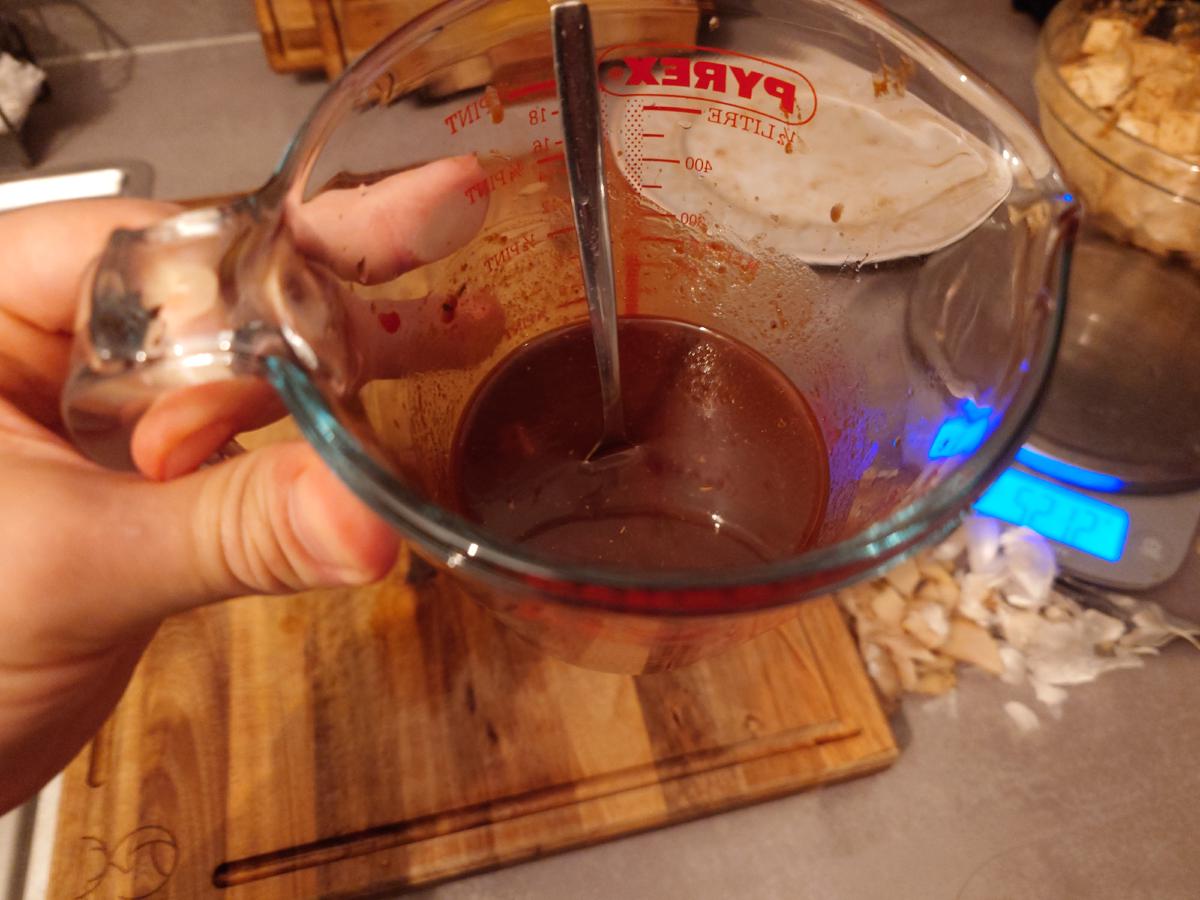 The finished sauce in the jug, dark red and thick