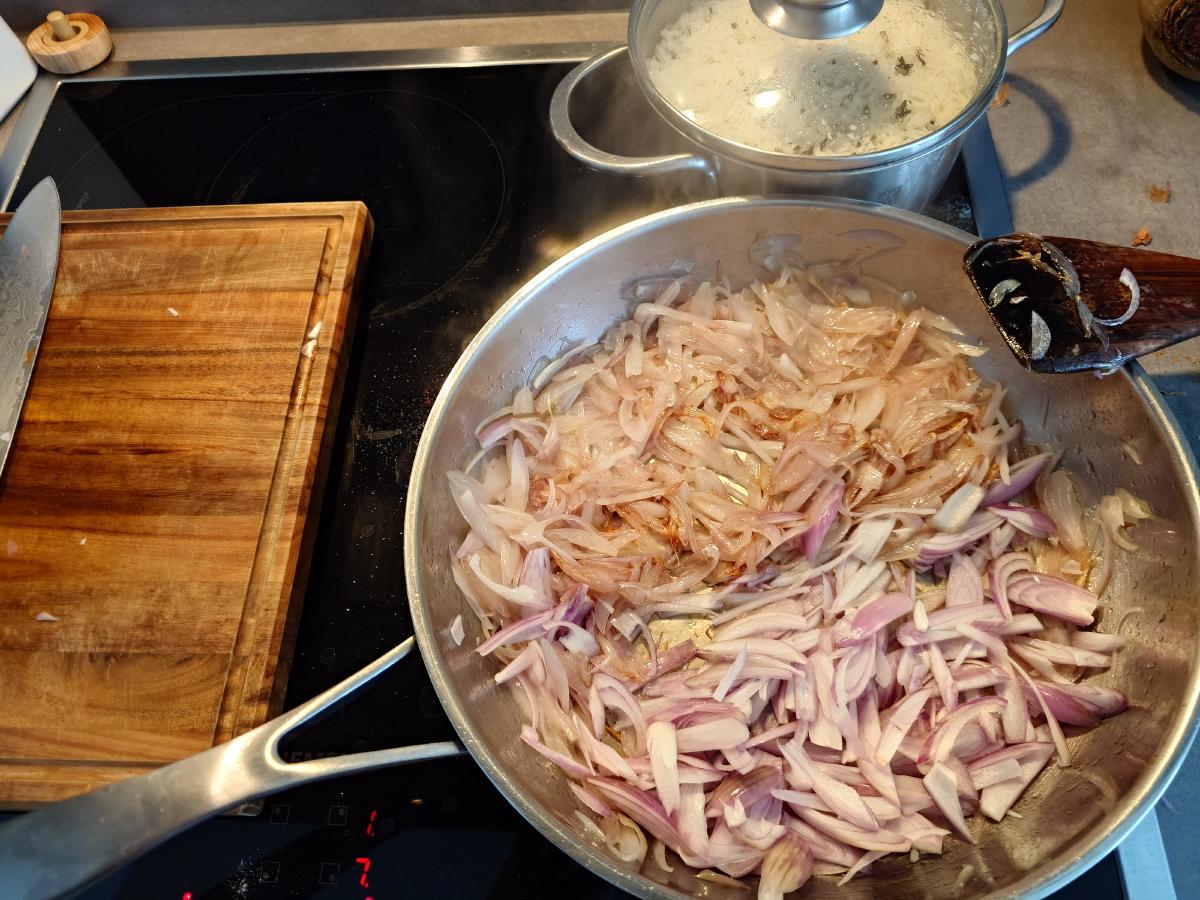 The same shallots gone brown and slack, raw ones still on top from the second board