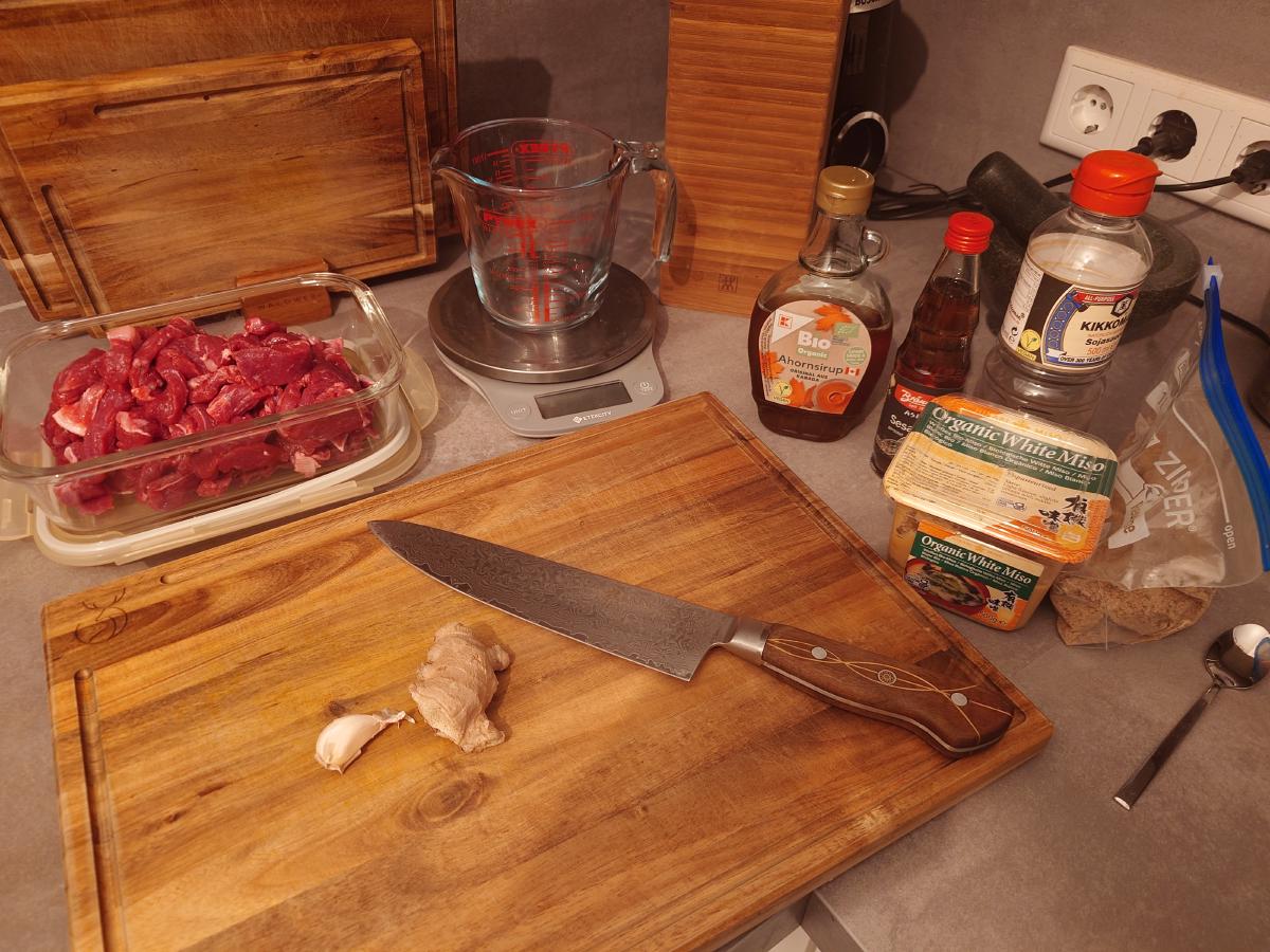 Beef packed away, ginger and garlic on the board, the rest lined up behind the scale