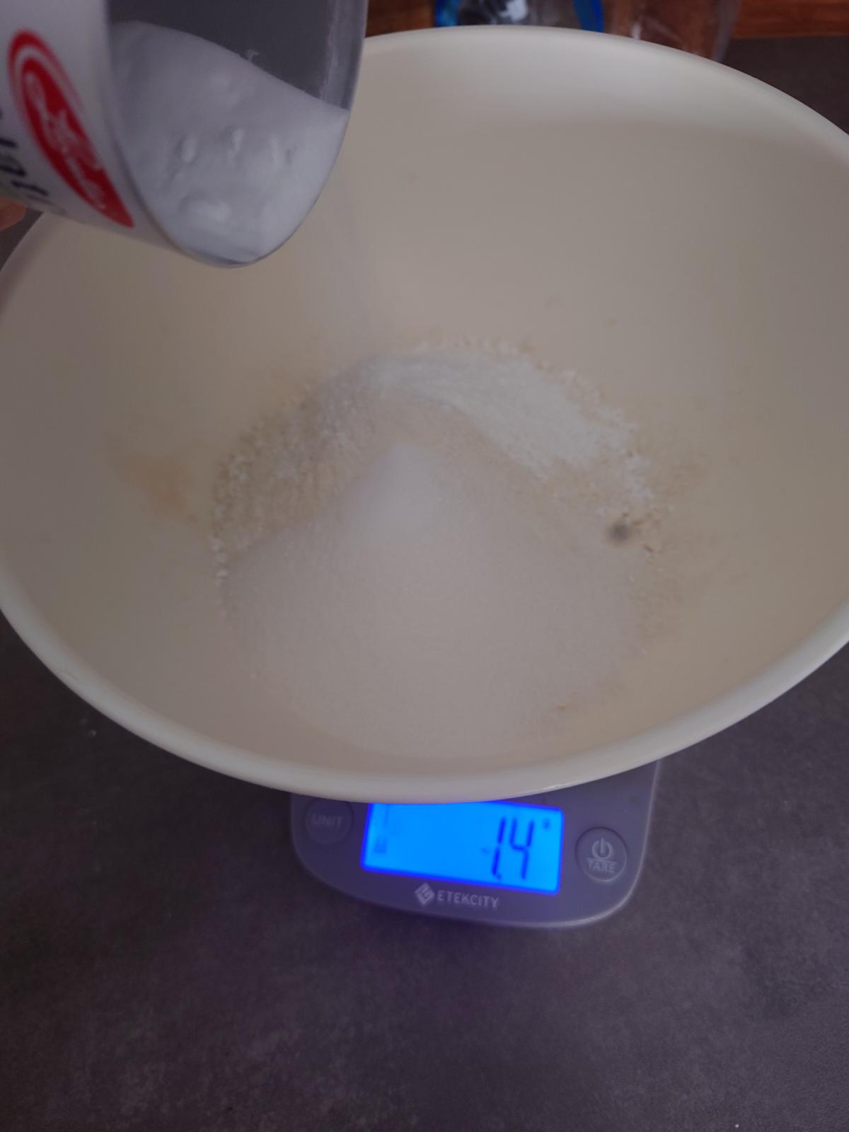 Baking soda tipped in from the tin, 1.4 g on the scale