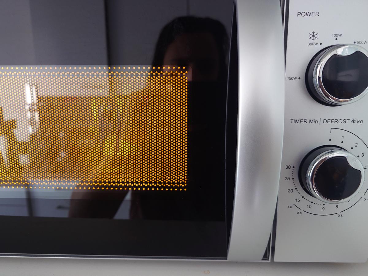 The jug in the microwave with the light on
