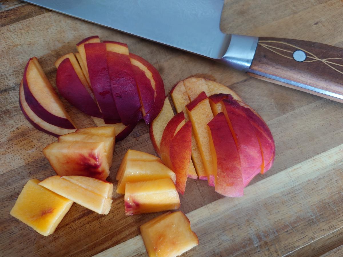 Nectarine sliced and cubed on the board