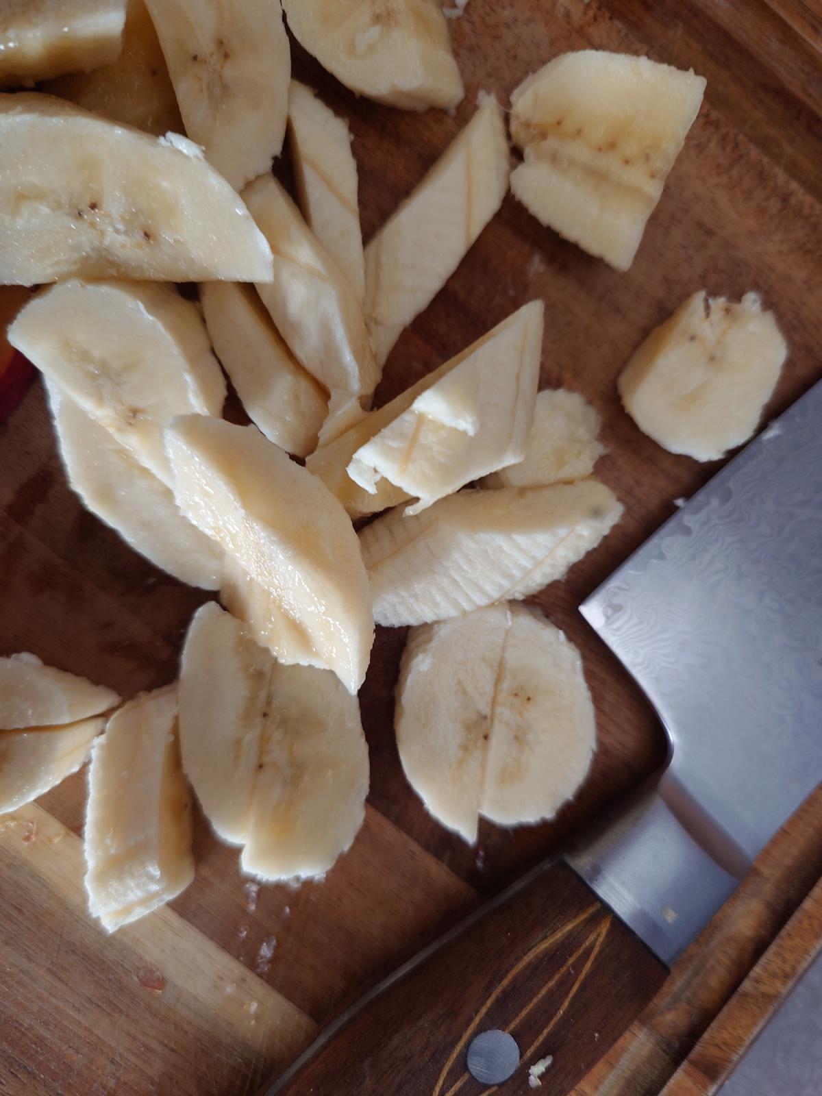 Banana cut into chunks on the board