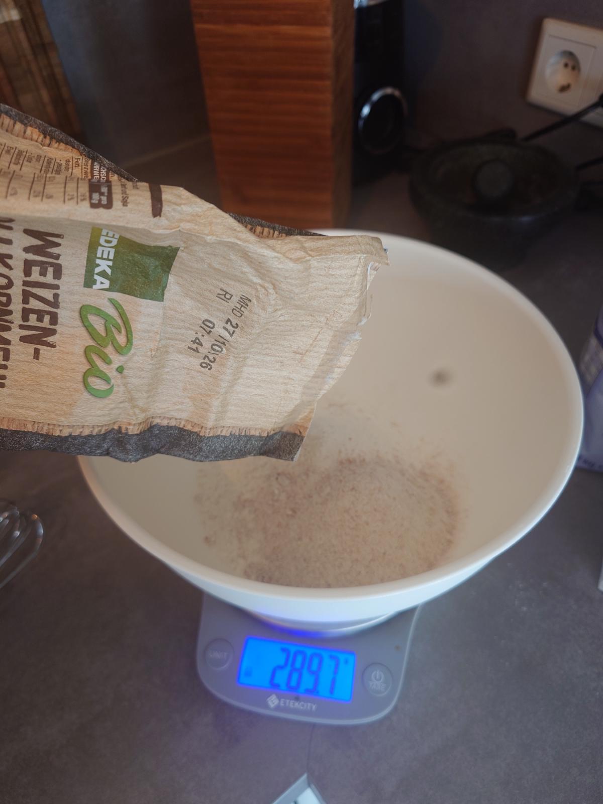 Flour poured into the bowl, just under 290 g on the scale