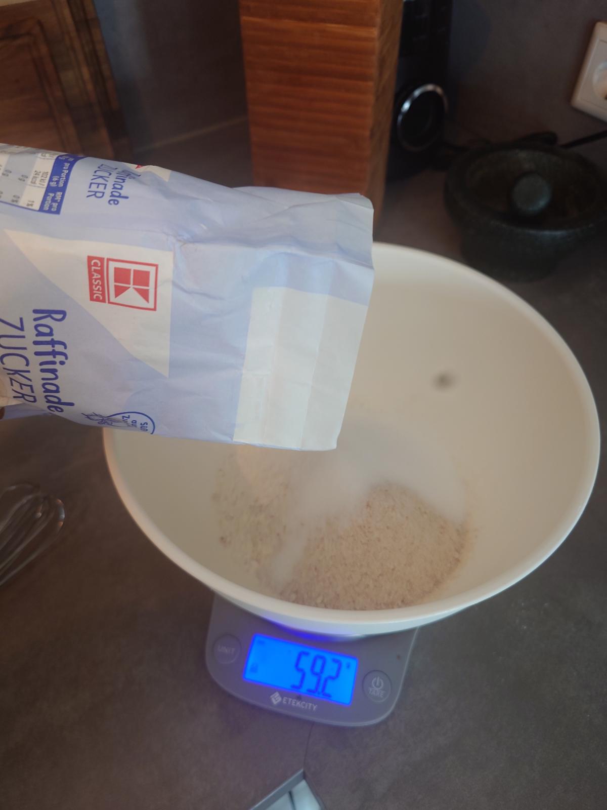 Sugar tipped in, 59 g on the scale