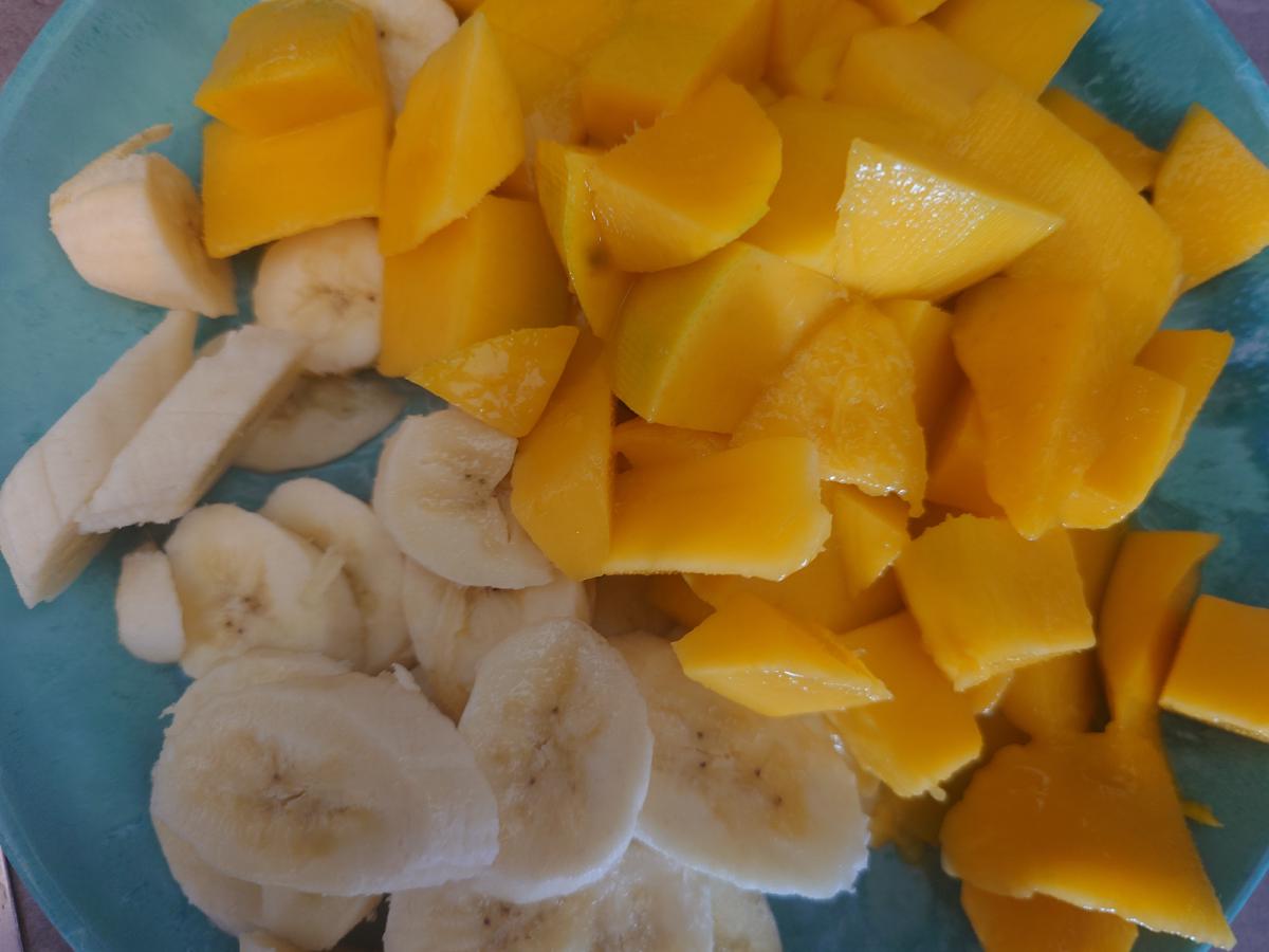 Banana and mango cubed on the plate