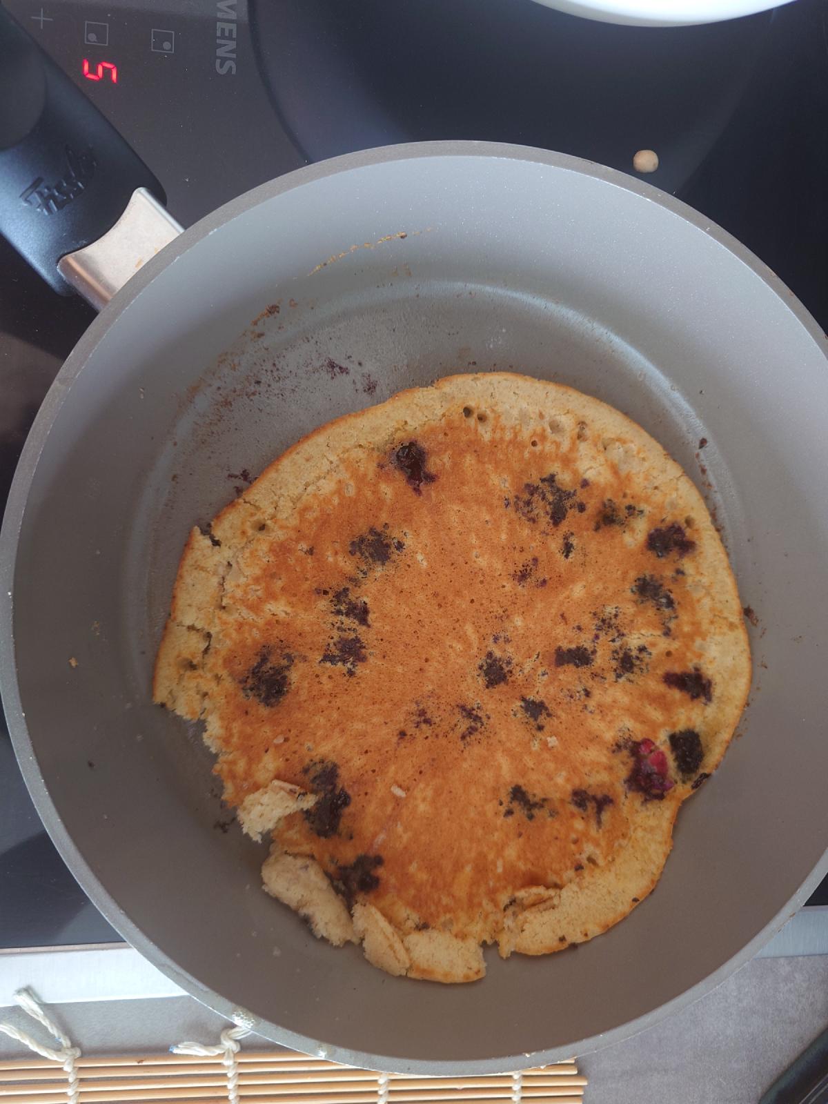 Flipped clean, deep golden with blueberries