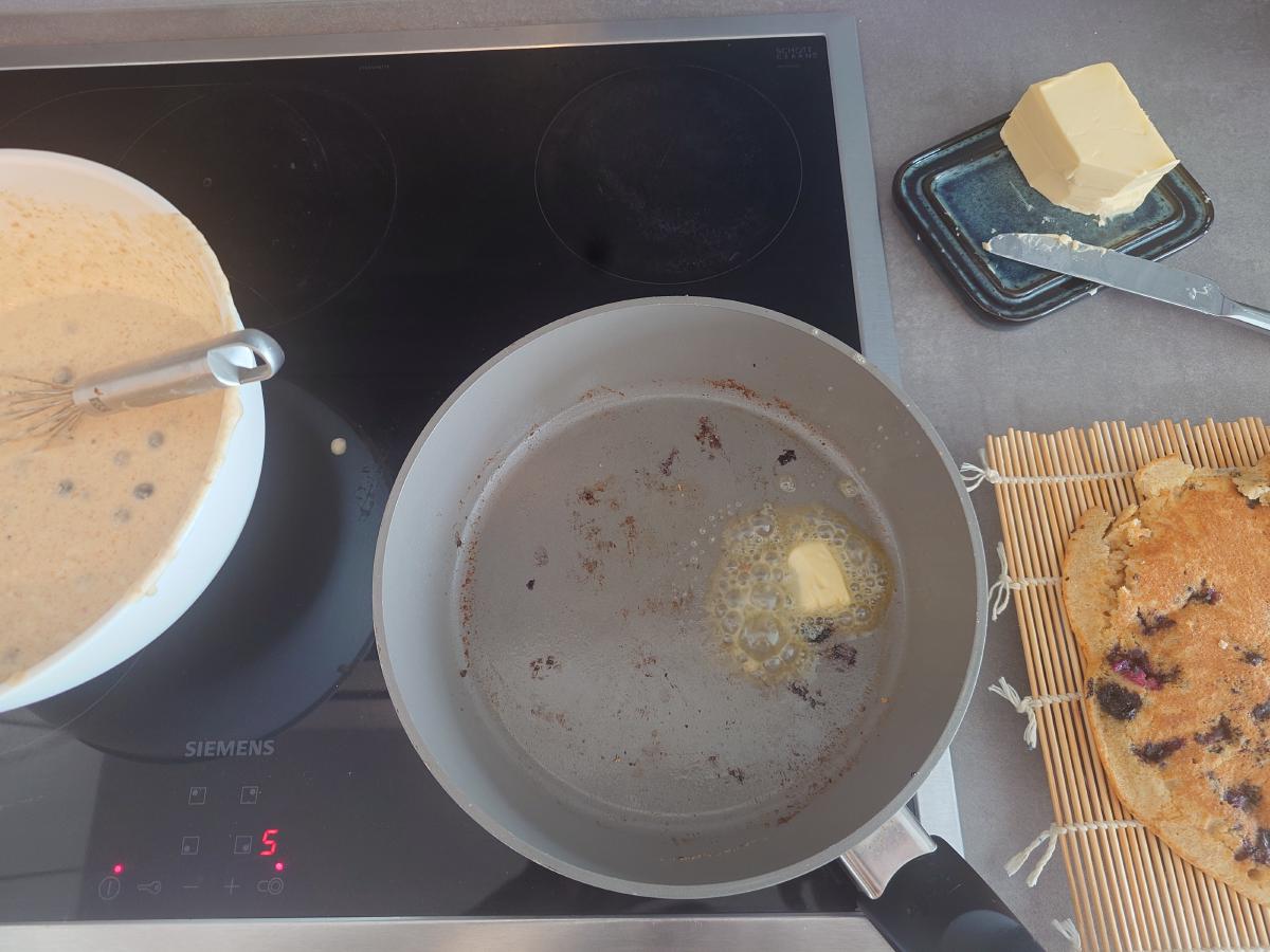 Butter going in for the next one, finished pancake resting