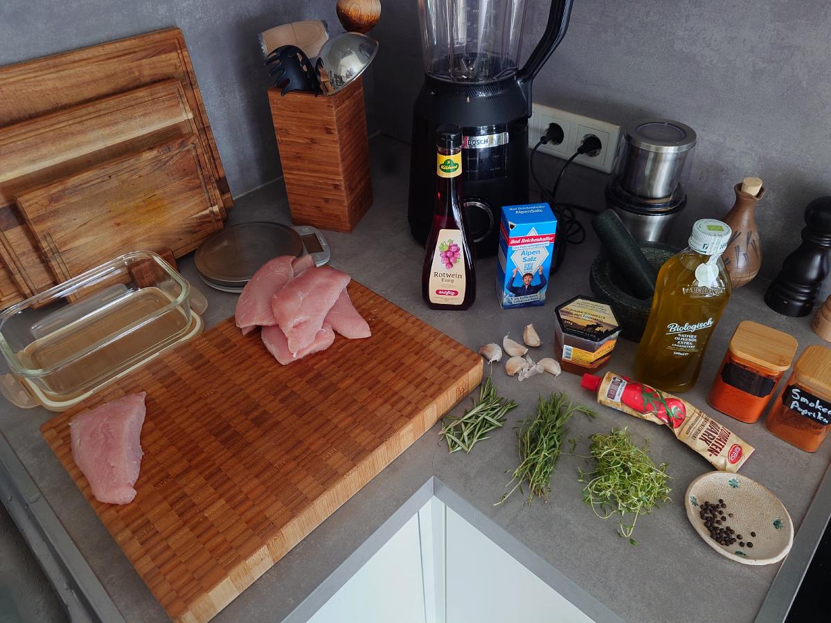 Turkey, herbs, oils and spices laid out on the counter