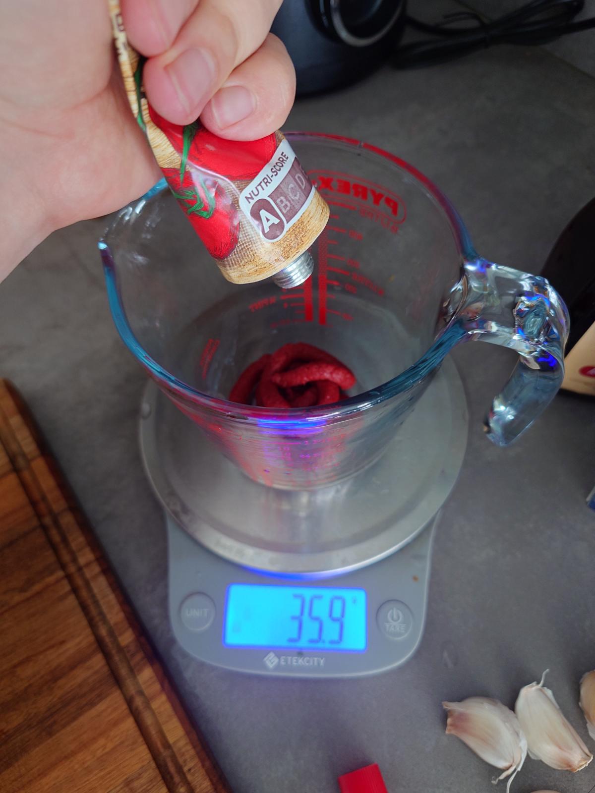 Tomato paste squeezed into the measuring cup