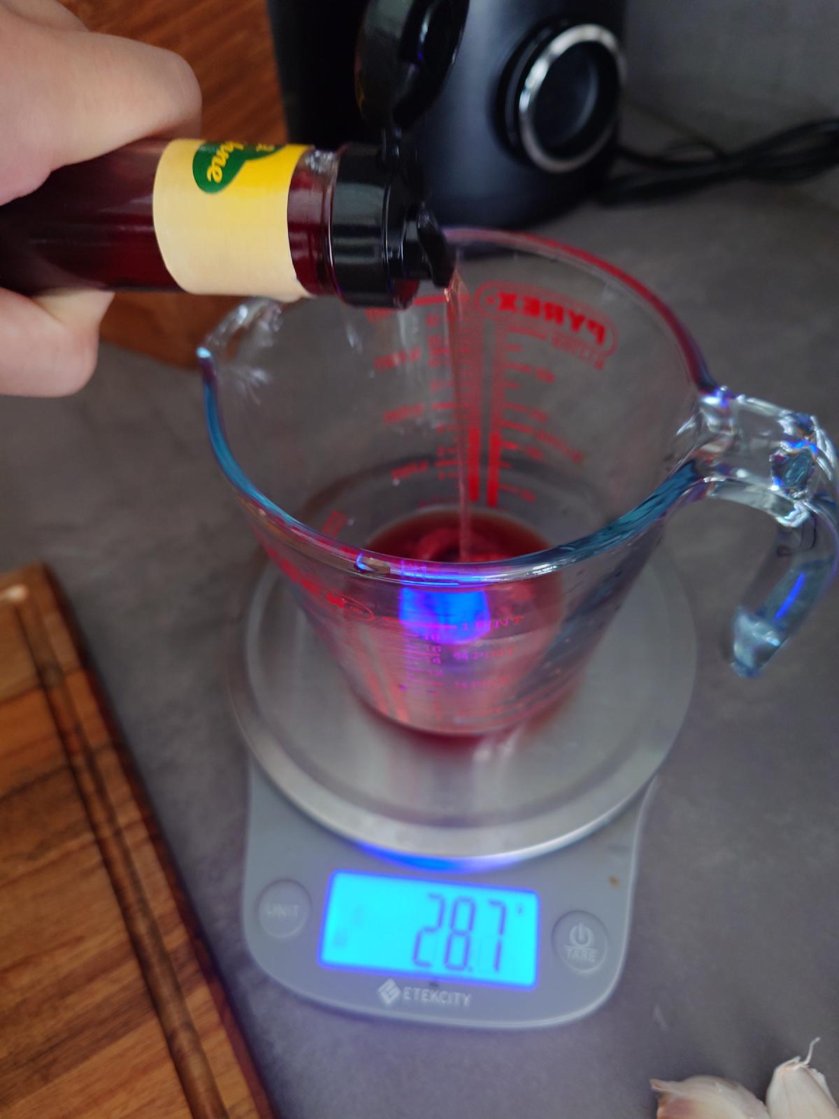 Red wine vinegar poured in