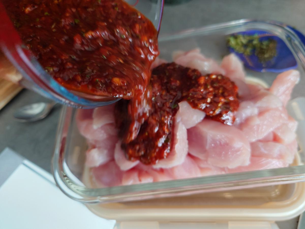 Marinade poured over the sliced turkey