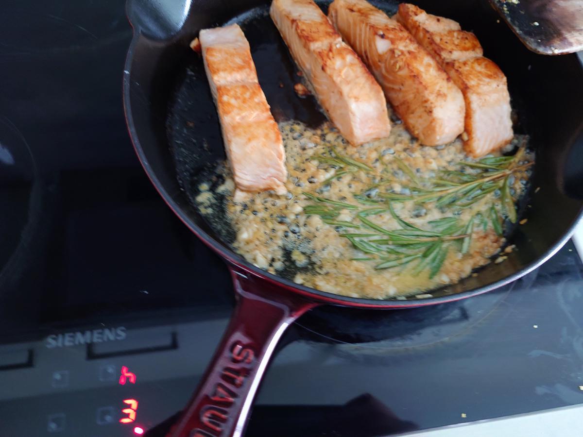 The butter foaming around the fish