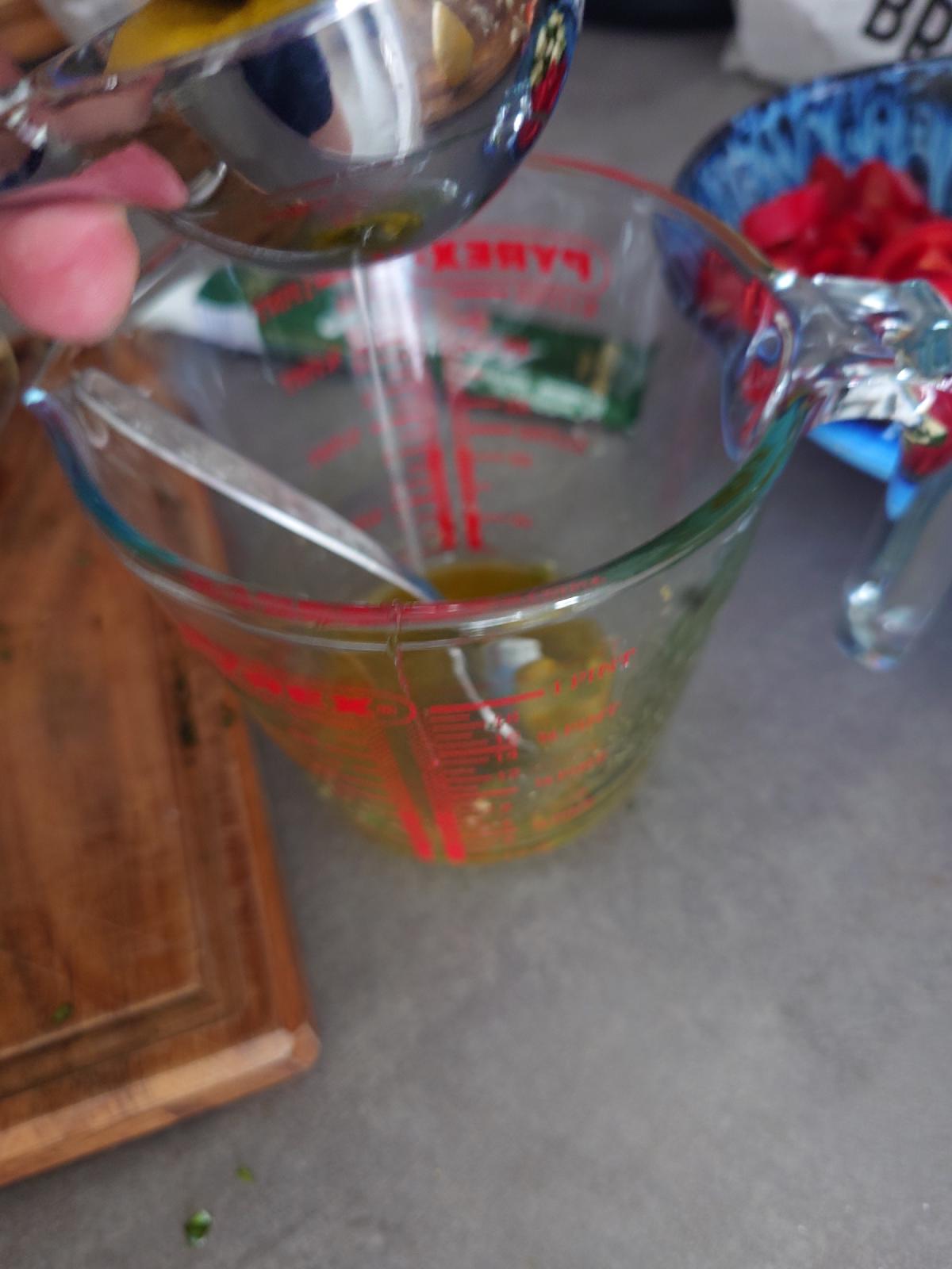 Oil poured into the measuring cup