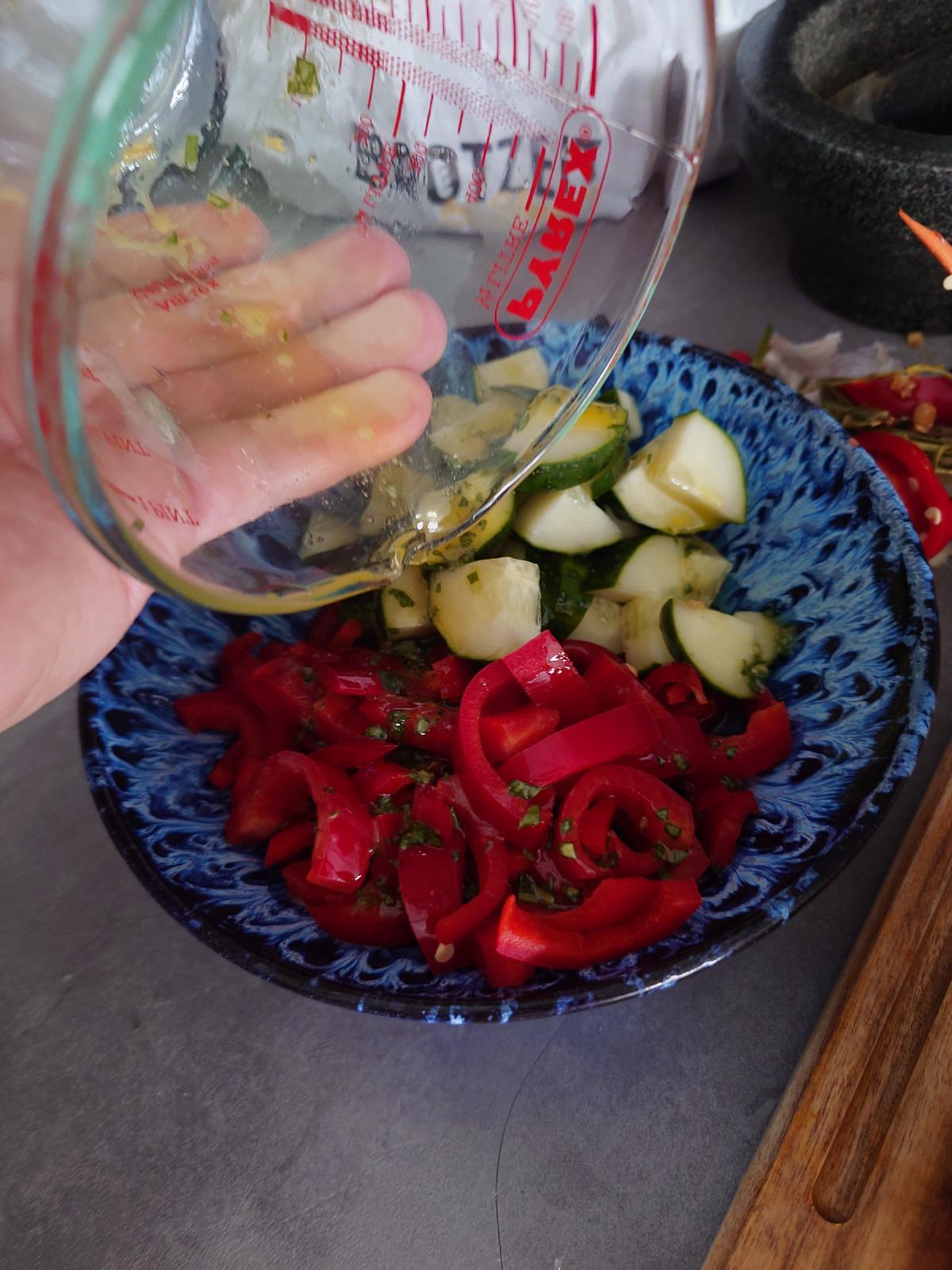 The dressing poured over the salad