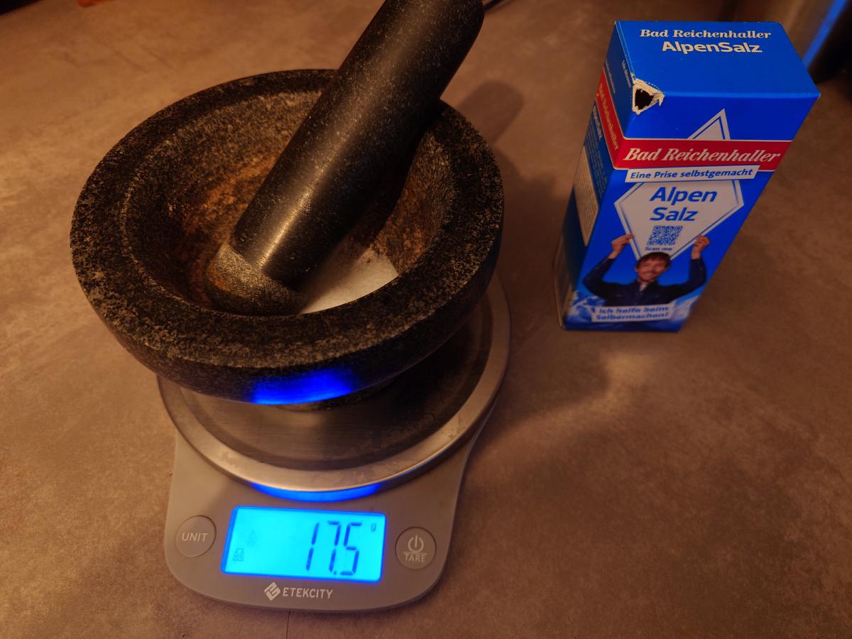 Salt weighed in the mortar on the scale