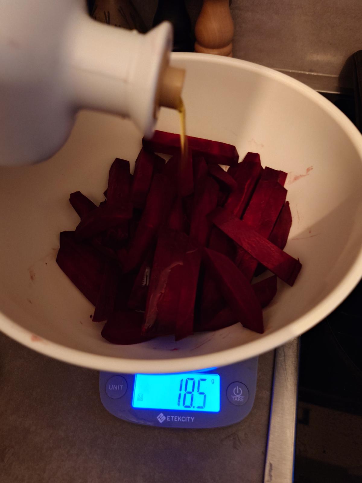 Olive oil poured over the batons in the bowl