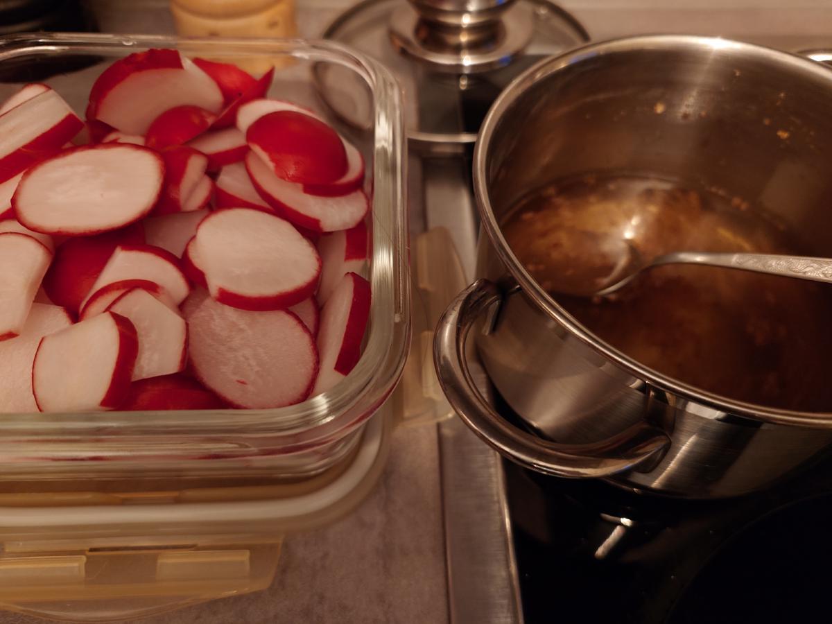 Radish slices packed into a glass container